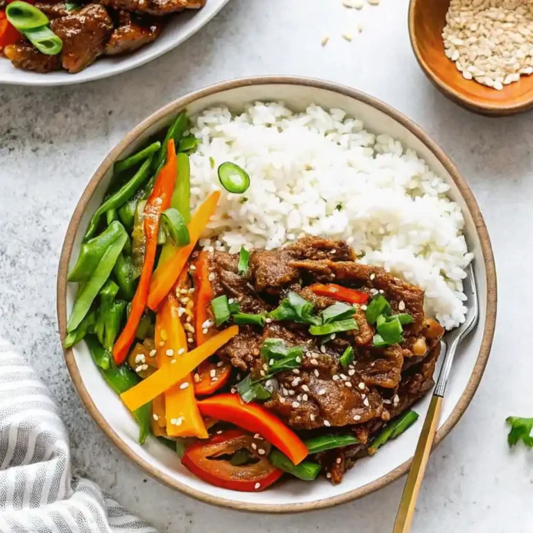 Instant Pot Mongolian Beef with sesame seeds over rice